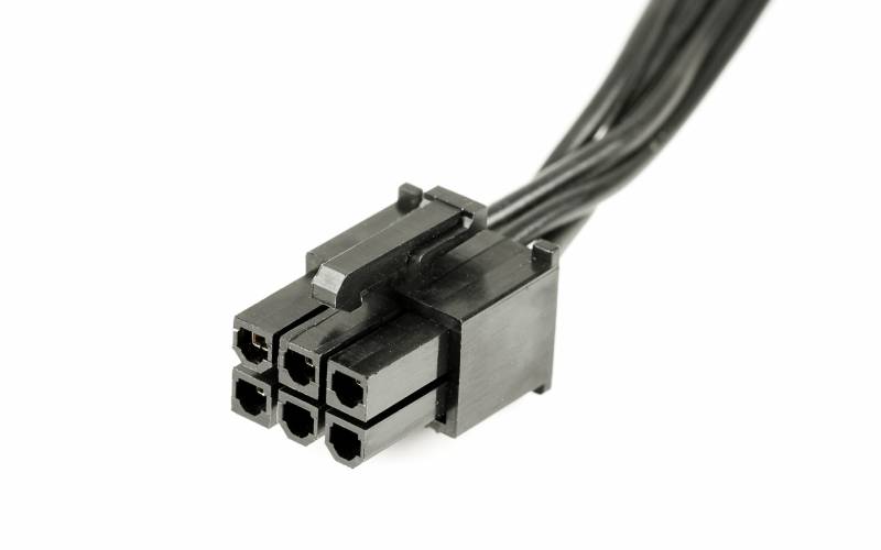 A black 6-pin connector with a plastic connector terminal and several black wires extending from the back.
