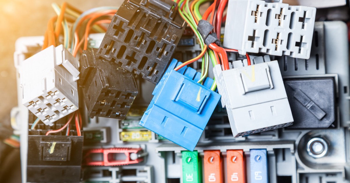 A pile of electrical connectors. The pile is messy and features parts in many colors, including blue, black, and red.